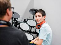 Boy learning drums