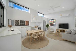 Elevate your living experience with our premium granny flats, now featuring an upgraded 3.4m high raked ceiling for enhanced lighting and spaciousness. Step into a stylish kitchen equipped with a luxurious 20mm Caesarstone ‘Turino’ bench stone, dazzling ‘White Gloss’ splash back, and elegant cupboards in White Semi-Gloss. Enjoy the contemporary look of ‘Vien Ivory’ Polished floor tiles and crisp walls finished in ‘Dulux Lexicon Quarter’, creating a sophisticated and inviting space you'll love to call home.