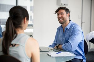 Osteopath Jerome Smith consulting with a patient at Above Health in Hornsby
