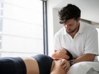 Osteopath Jerome Smith treating an active young woman at Above Health in Hornsby
